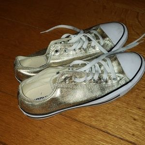 Gold Converse low tops